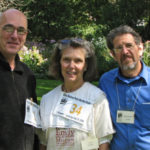 Three smiling volunteers at the Amherst poetry fest, 2009