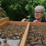 Archaeologists looking over artifacts found at the museum