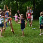 Children playing on stilts at the circus