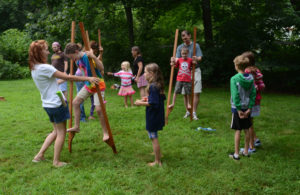 Children playing on stilts at the circus