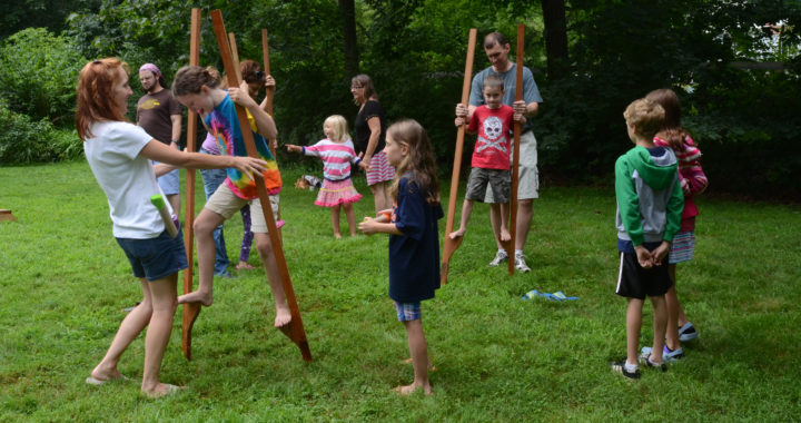 Children playing on stilts at the circus