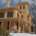 The Evergeens house in winter with snow on the ground