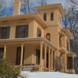 The Evergeens house in winter with snow on the ground