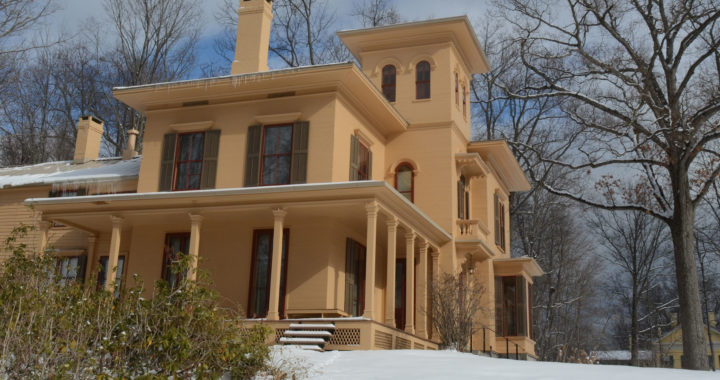 The Evergeens house in winter with snow on the ground