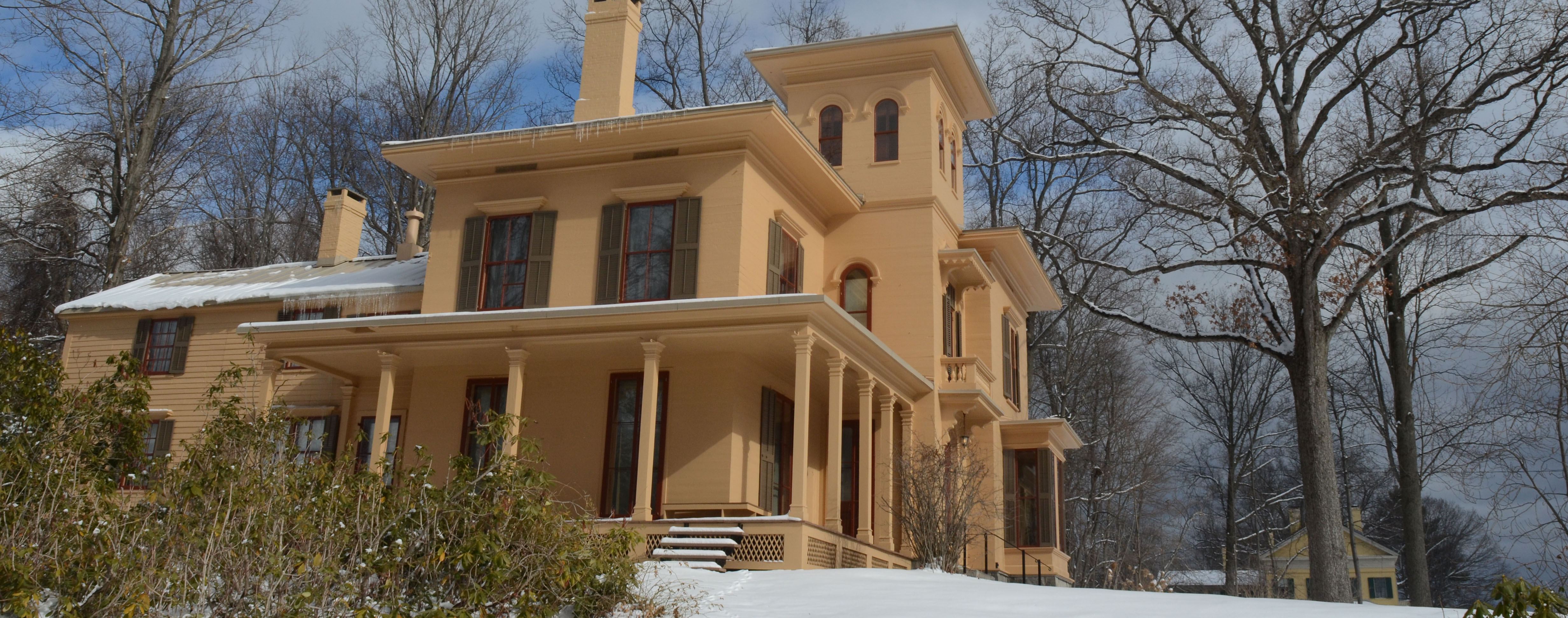 The Evergeens house in winter with snow on the ground