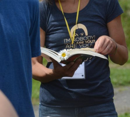 a person holds the complete works of Emily Dickinson