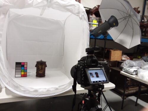 Collections set up for the Museum. A camera faces an object sitting in a photo tent. Each item in the Collections is documented like this. 
