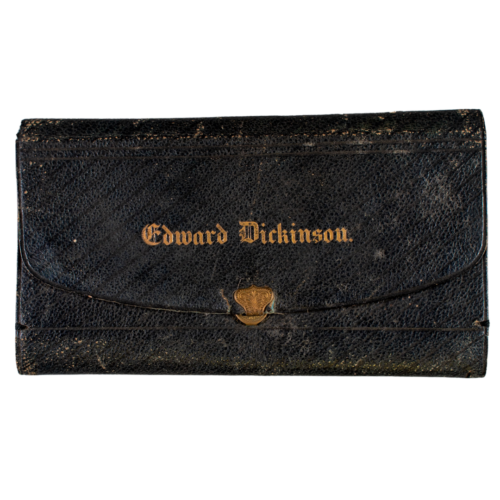 A black leather wallet with gold writing that says "Edward Dickinson"