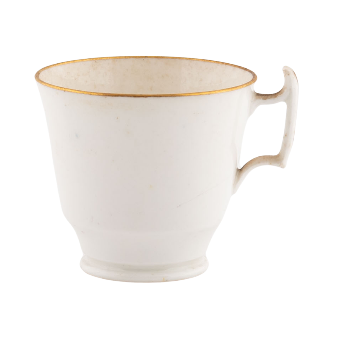An ornate and delicate teacup with gold trim.