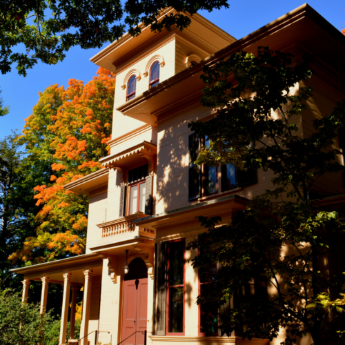 the Evergreens surrounded by beautiful fall trees