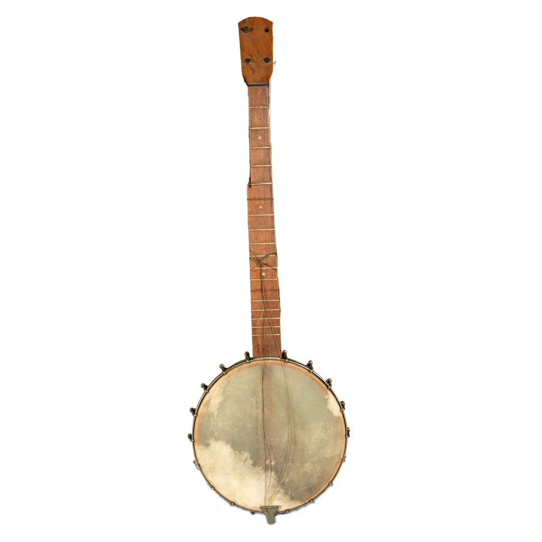 A four string banjo. The strings are broken and the neck is badly damaged.