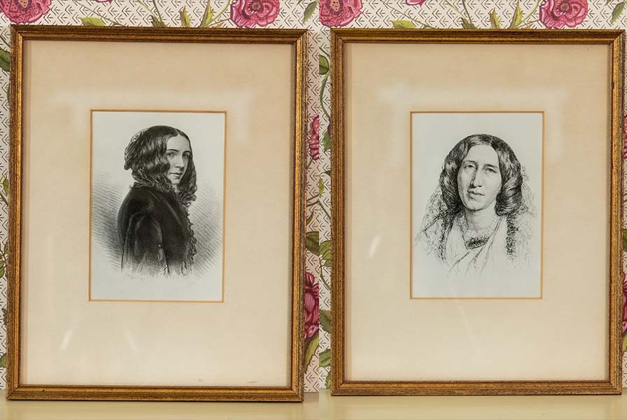 Two matted prints in gilded wood frames depicting iconic portraits of George Eliot & Elizabeth Barrett Browning.
