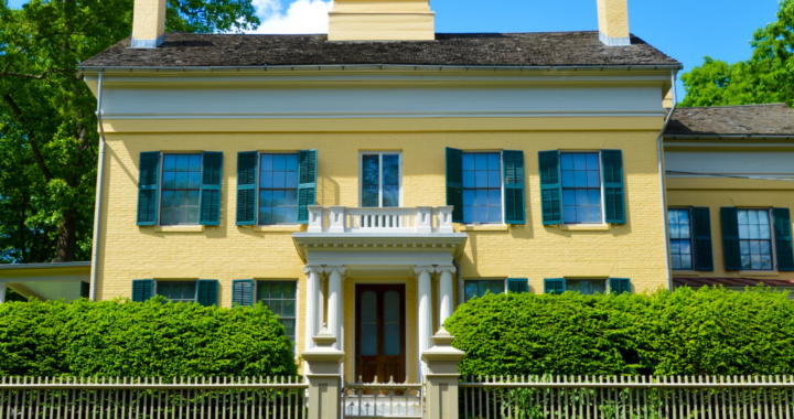 the exterior of Emily Dickinson's yellow house on a sunny day