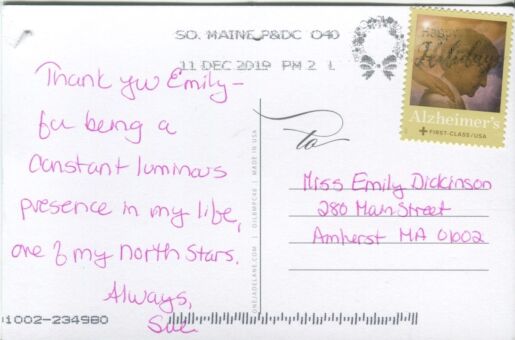 A handwritten message on the back of a postcard.