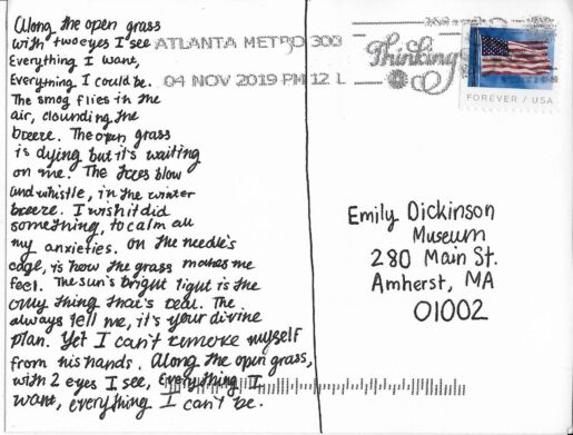 Postcard verso featuring a handwritten inscription in black ink