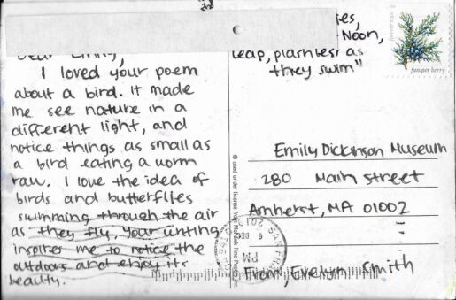 Postcard verso featuring a handwritten inscription in black ink