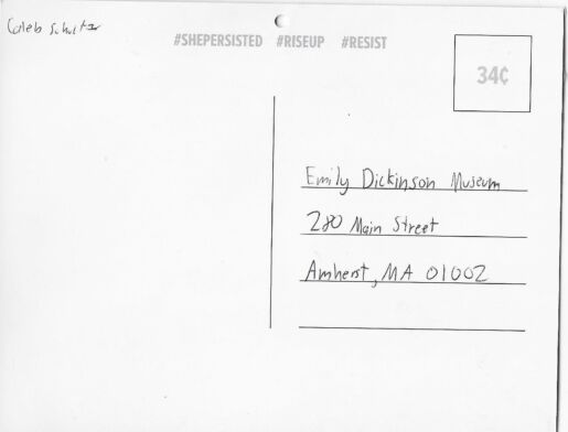 Postcard verso featuring a signature in pen