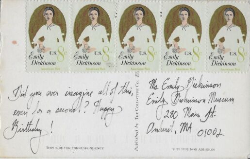 postcard verso with Emily Dickinson stamps and handwritten inscription in black ink