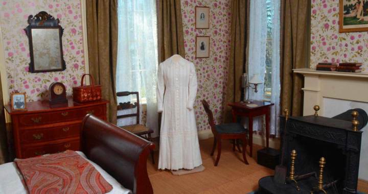 Emily Dickinson's white dress on a stand in her bedroom