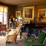 The Evergreens parlor filled with Dickinson family objects including furniture, paintings, instruments and more