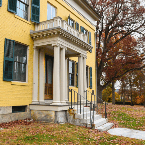 front door of the Homestead surround by leaves