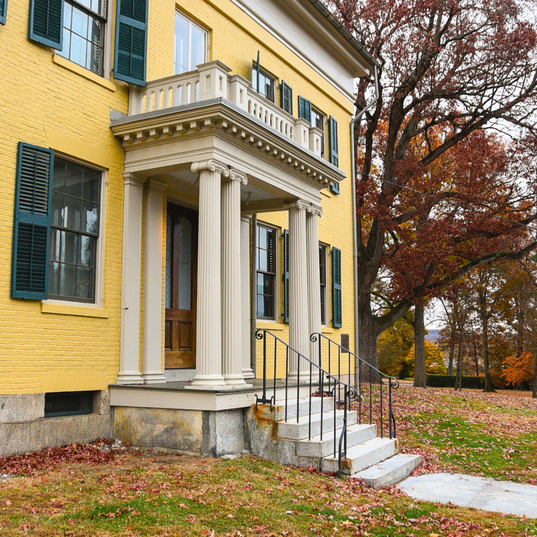 front door of the Homestead surround by leaves
