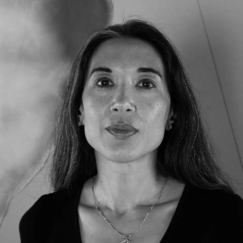 tina cane headshot - a woman looks confidently into the camera lens